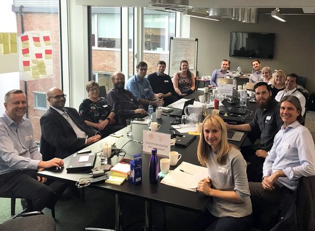 Representatives from the Geospatial Commission sat around a table at a Data Discovery workshop