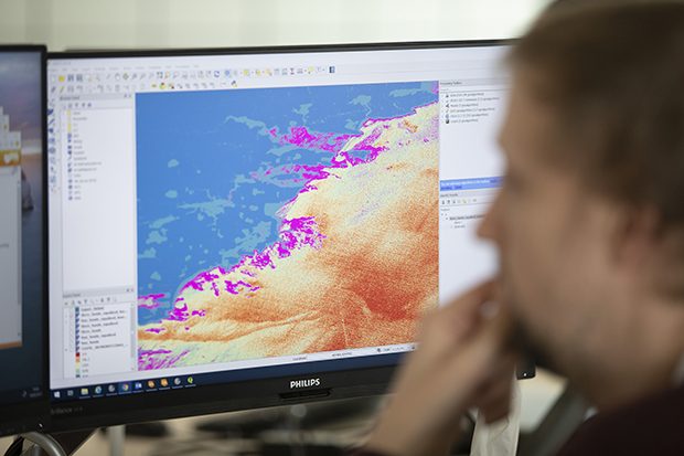 UKHO staff analysing coastal data sets 